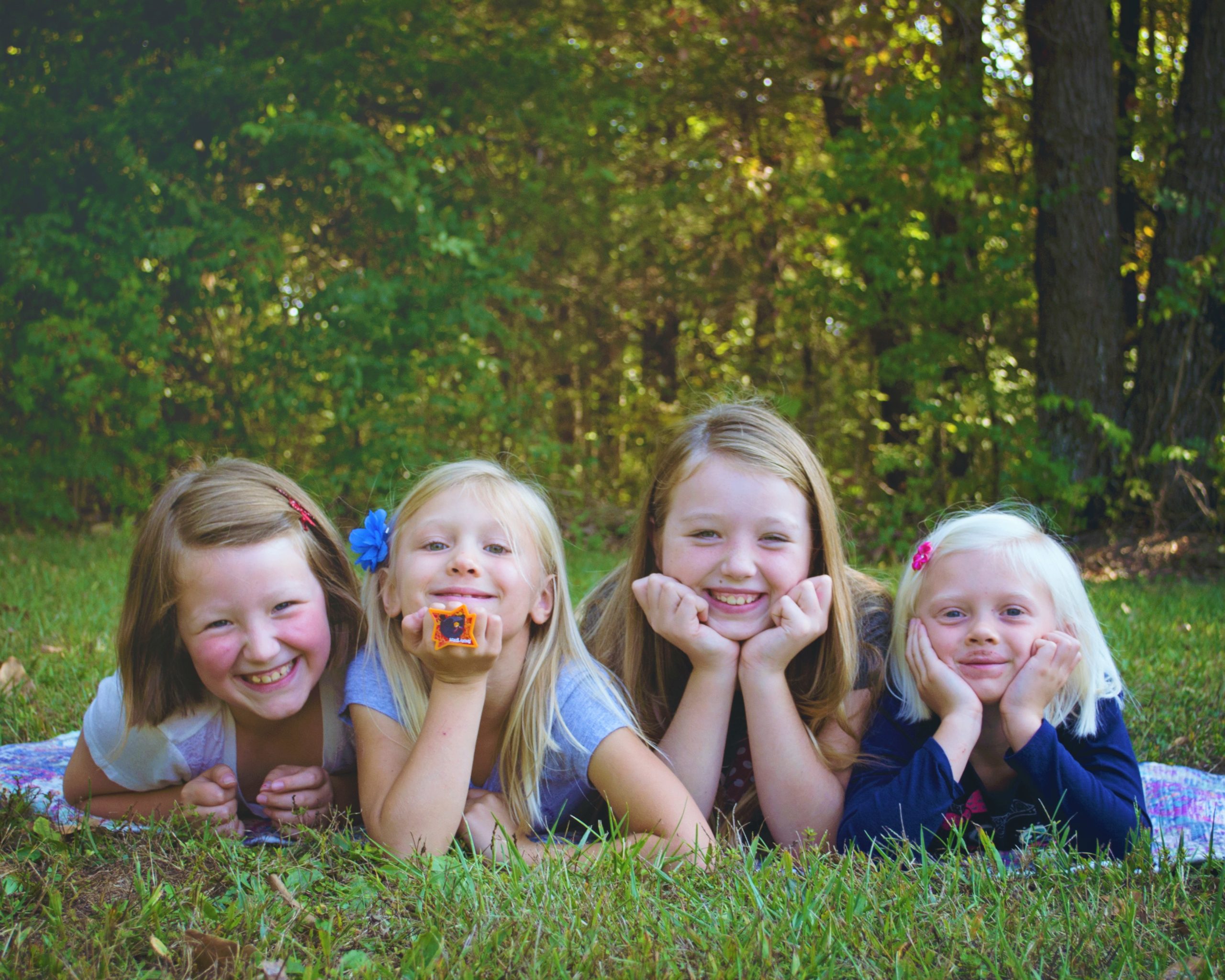 Four children smiling.